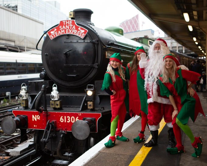 Santa Claus with elves and luxury christmas train