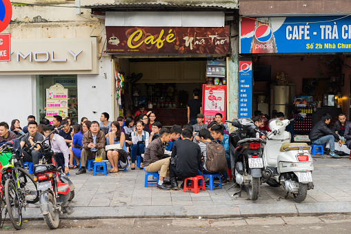 hanoi-vietnam-people-drink-coffee-tea-or-juice-fruit-on-cafe-stall-on-sidewalk