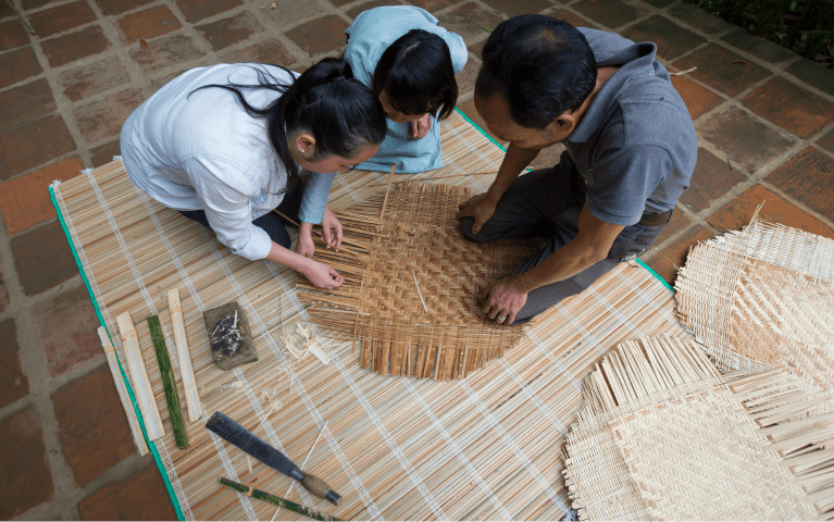 people-bending-and-waving-bamboo