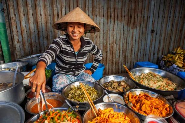 Vietnam’s Cultural Heritage: Understanding the Origins of the Vietnamese People 12 vietnamese-food-vendor-on-local-market