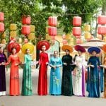 vietnamese women wearing ao dai with different designs and colors