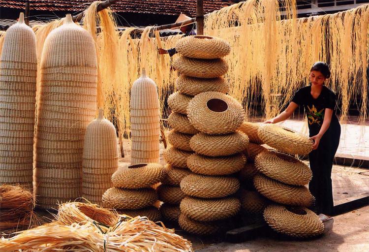 woman-stacking-bamboo-products